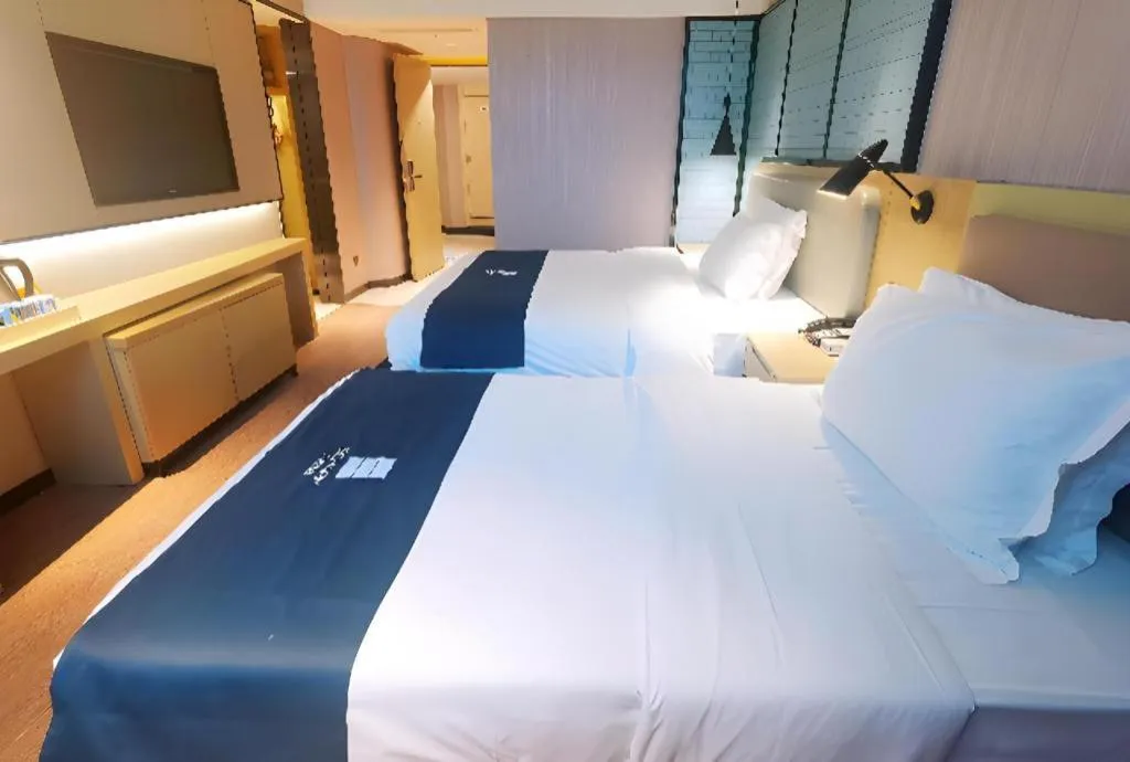 Bed in Echarm Hotel Wuhan Vanke Future Center Wulidun Metro Station