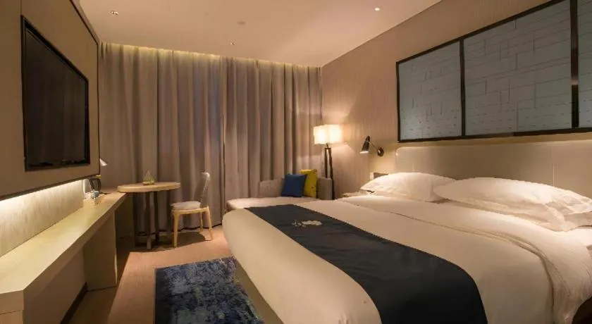 Bed in Echarm Hotel Wuhan Vanke Future Center Wulidun Metro Station