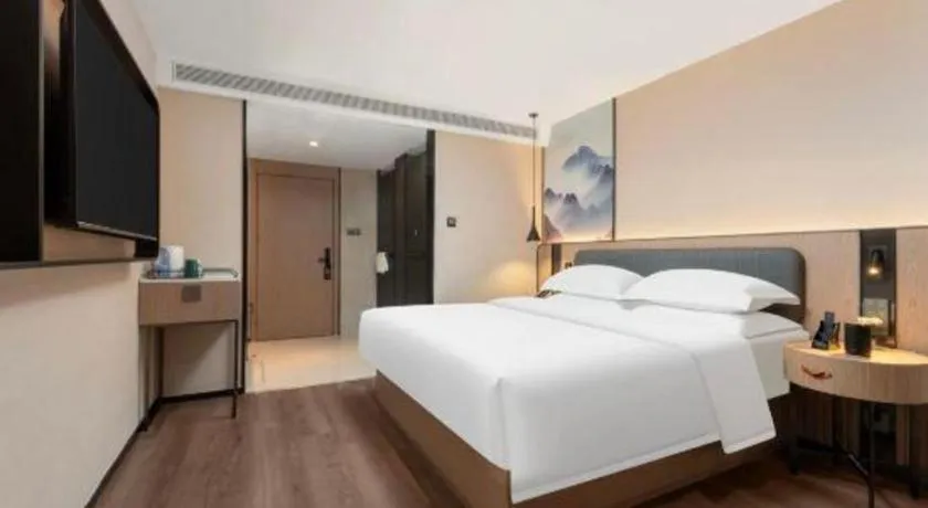 Bed in Echarm Hotel Wuhan Vanke Future Center Wulidun Metro Station