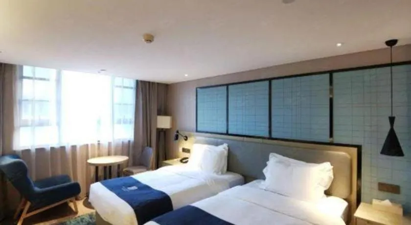 Bed in Echarm Hotel Wuhan Vanke Future Center Wulidun Metro Station