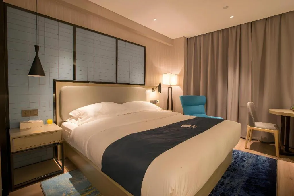 Bed in Echarm Hotel Wuhan Vanke Future Center Wulidun Metro Station