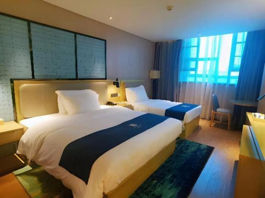 Bed in Echarm Hotel Wuhan Vanke Future Center Wulidun Metro Station