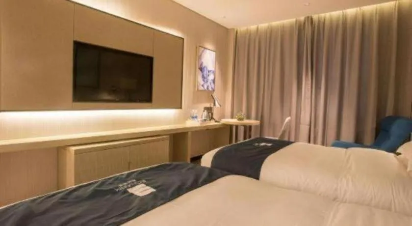 Bed in Echarm Hotel Wuhan Vanke Future Center Wulidun Metro Station