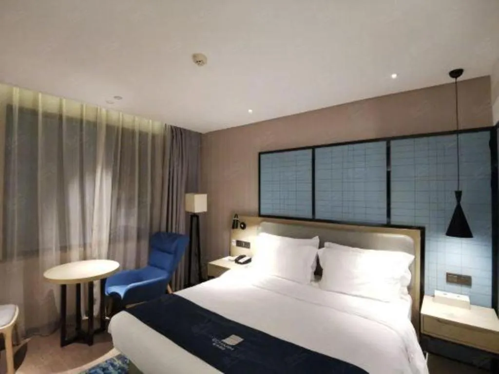 Bed in Echarm Hotel Wuhan Vanke Future Center Wulidun Metro Station