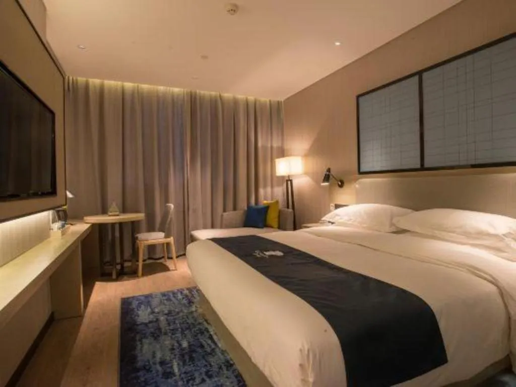 Bed in Echarm Hotel Wuhan Vanke Future Center Wulidun Metro Station