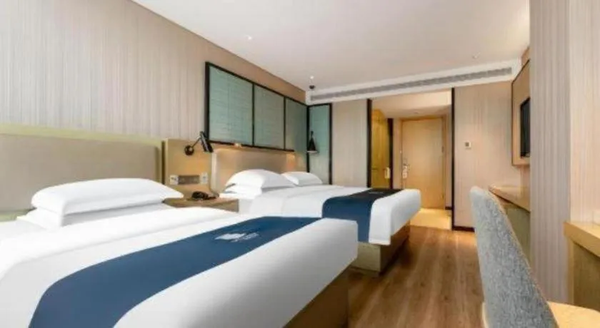 Bed in Echarm Hotel Wuhan Vanke Future Center Wulidun Metro Station