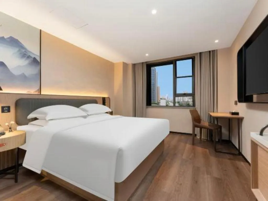 Bed in Echarm Hotel Wuhan Vanke Future Center Wulidun Metro Station