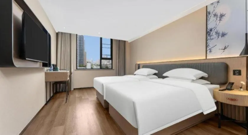 Bed in Echarm Hotel Wuhan Vanke Future Center Wulidun Metro Station