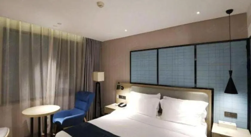 Bed in Echarm Hotel Wuhan Vanke Future Center Wulidun Metro Station