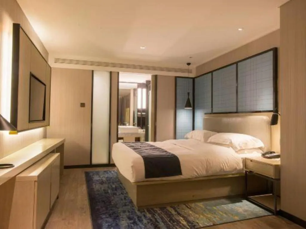 Bed in Echarm Hotel Wuhan Vanke Future Center Wulidun Metro Station