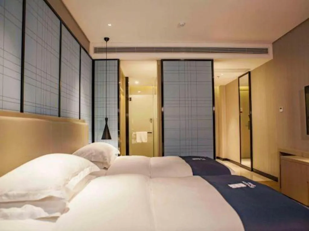 Bed in Echarm Hotel Wuhan Vanke Future Center Wulidun Metro Station
