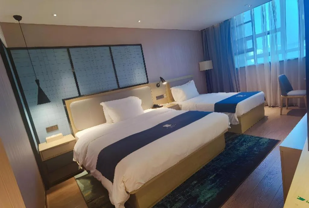 Bed in Echarm Hotel Wuhan Vanke Future Center Wulidun Metro Station