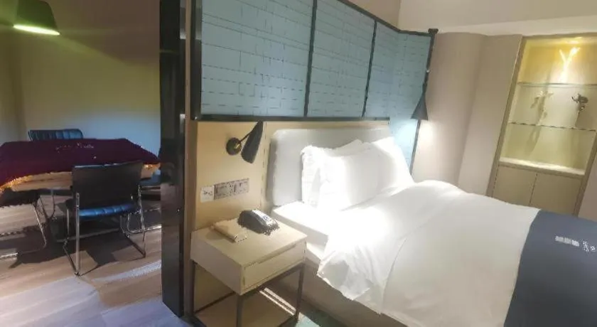 Bed in Echarm Hotel Wuhan Vanke Future Center Wulidun Metro Station