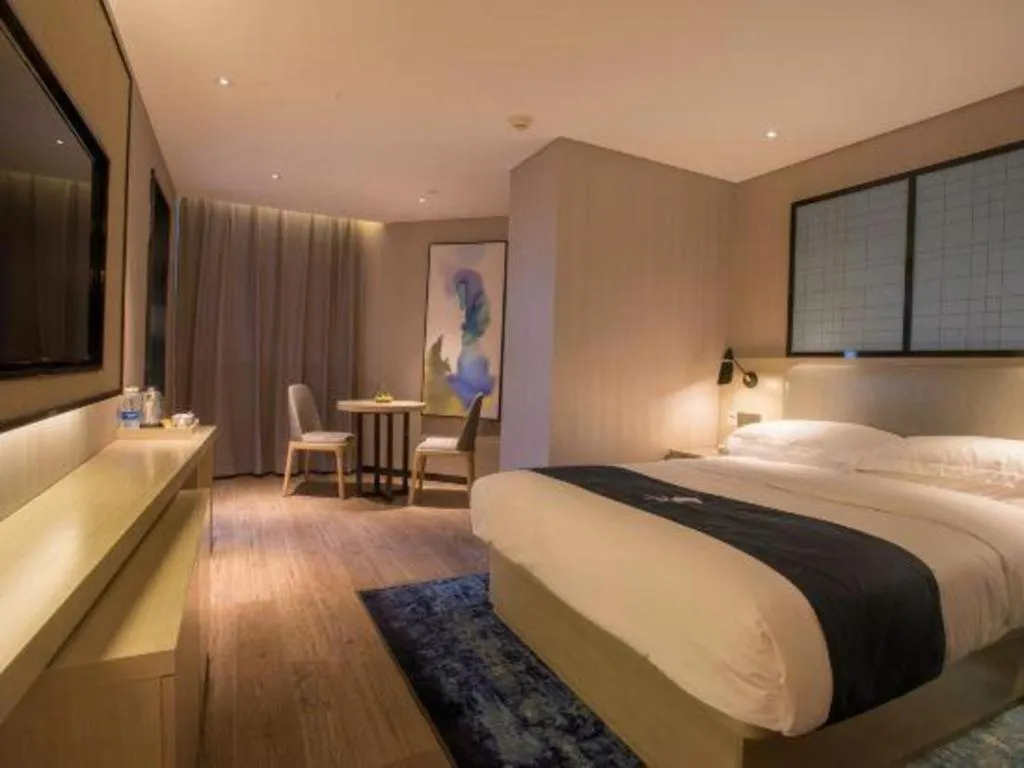 Bed in Echarm Hotel Wuhan Vanke Future Center Wulidun Metro Station