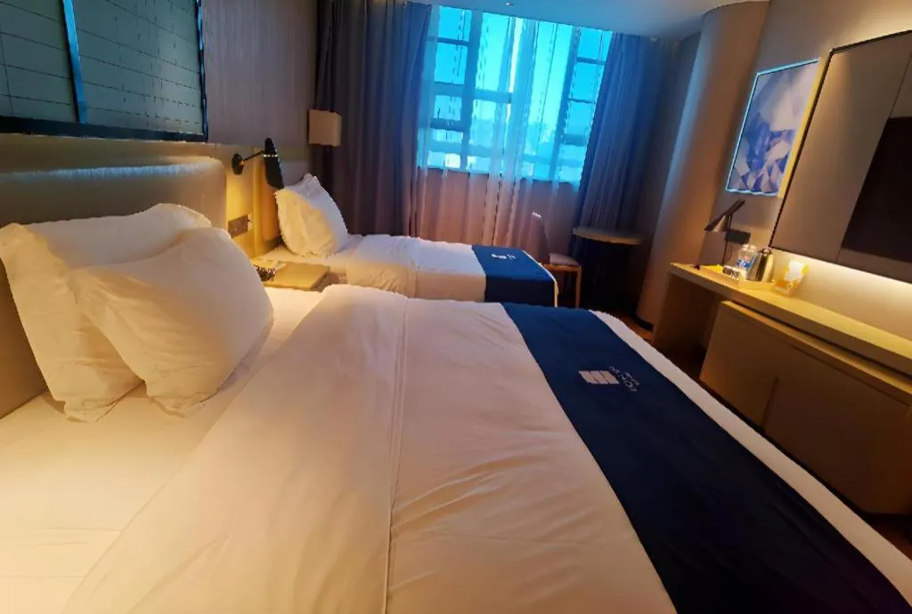 Bed in Echarm Hotel Wuhan Vanke Future Center Wulidun Metro Station