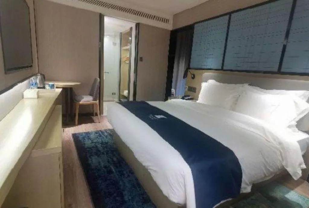 Bed in Echarm Hotel Wuhan Vanke Future Center Wulidun Metro Station