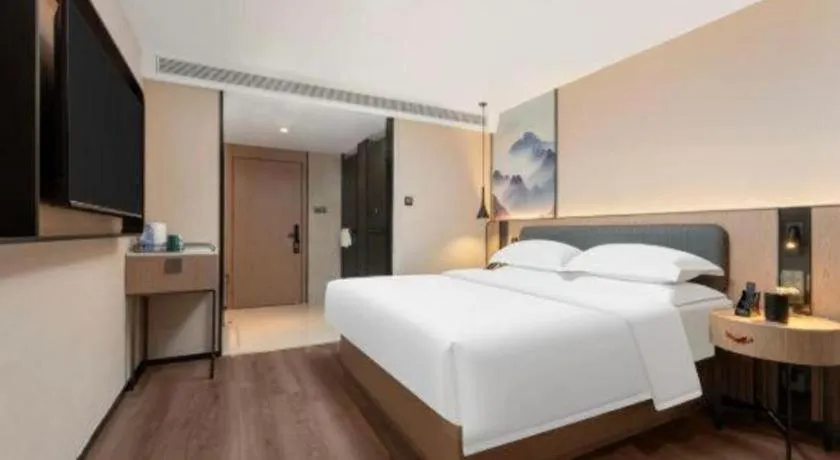 Bed in Echarm Hotel Wuhan Vanke Future Center Wulidun Metro Station