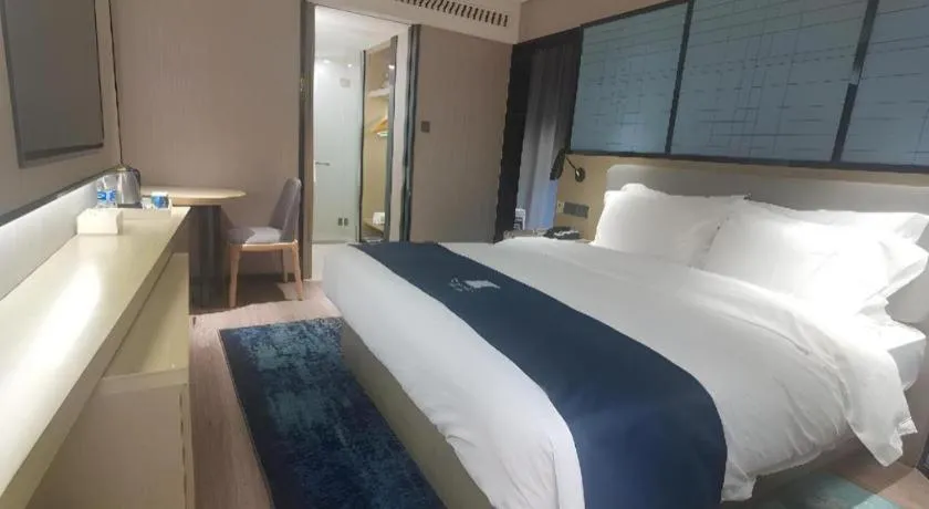 Bed in Echarm Hotel Wuhan Vanke Future Center Wulidun Metro Station