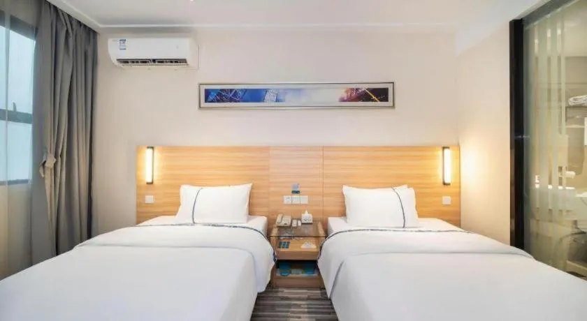 Bed in City Comfort Inn Wuhan East Lake Scenic Area Happy Valley