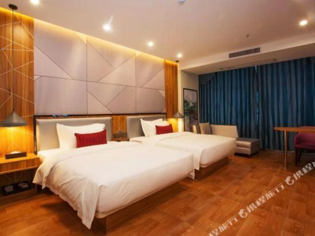 Bed in Borrman Hotel Fangchenggang High-speed Railway North Station Crystal International