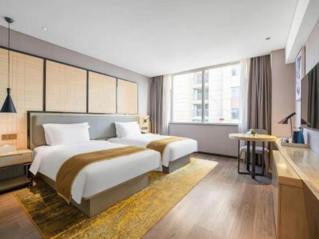 Bed in Echarm Hotel Zibo Gaoqing Zhongcheng Inernational