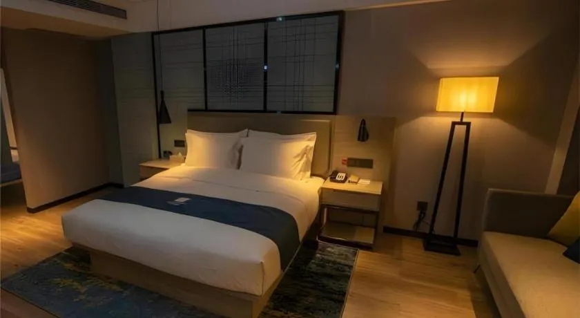 Bed in Echarm Hotel Zibo Gaoqing Zhongcheng Inernational