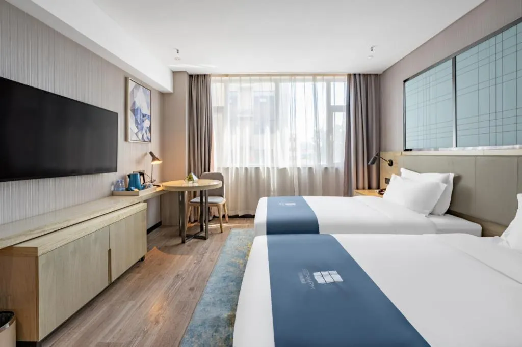 Bed in Echarm Hotel Zibo Gaoqing Zhongcheng Inernational