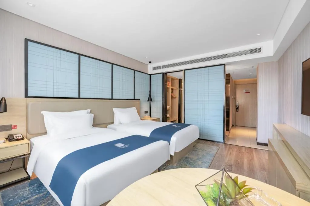 Bed in Echarm Hotel Zibo Gaoqing Zhongcheng Inernational
