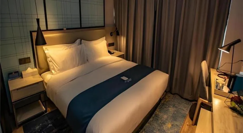 Bed in Echarm Hotel Zibo Gaoqing Zhongcheng Inernational