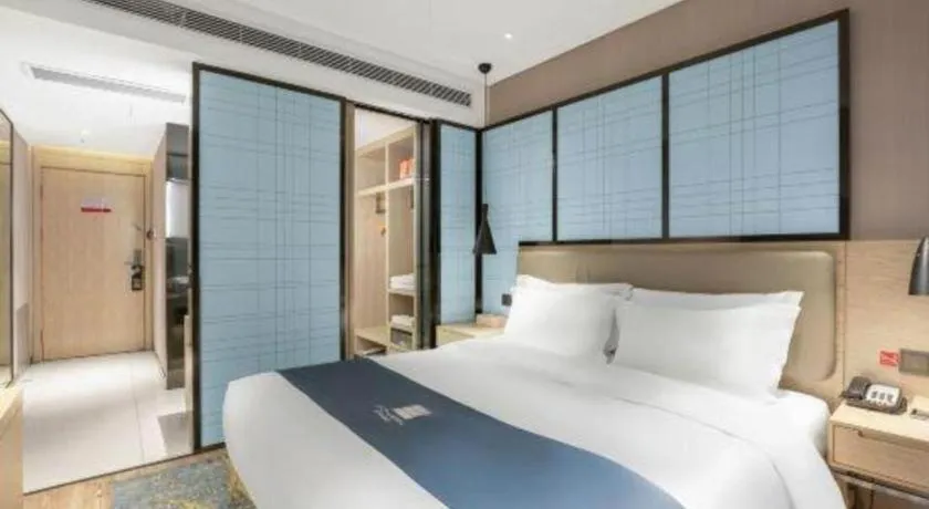 Bed in Echarm Hotel Zibo Gaoqing Zhongcheng Inernational