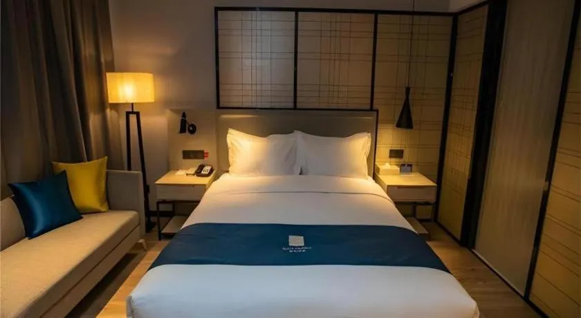 Bed in Echarm Hotel Zibo Gaoqing Zhongcheng Inernational