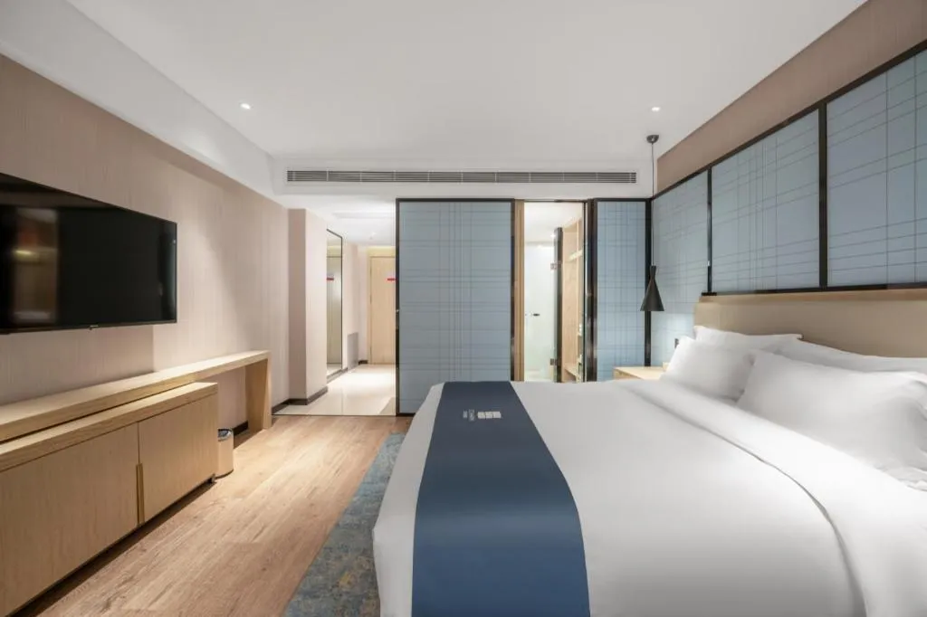 Bed in Echarm Hotel Zibo Gaoqing Zhongcheng Inernational