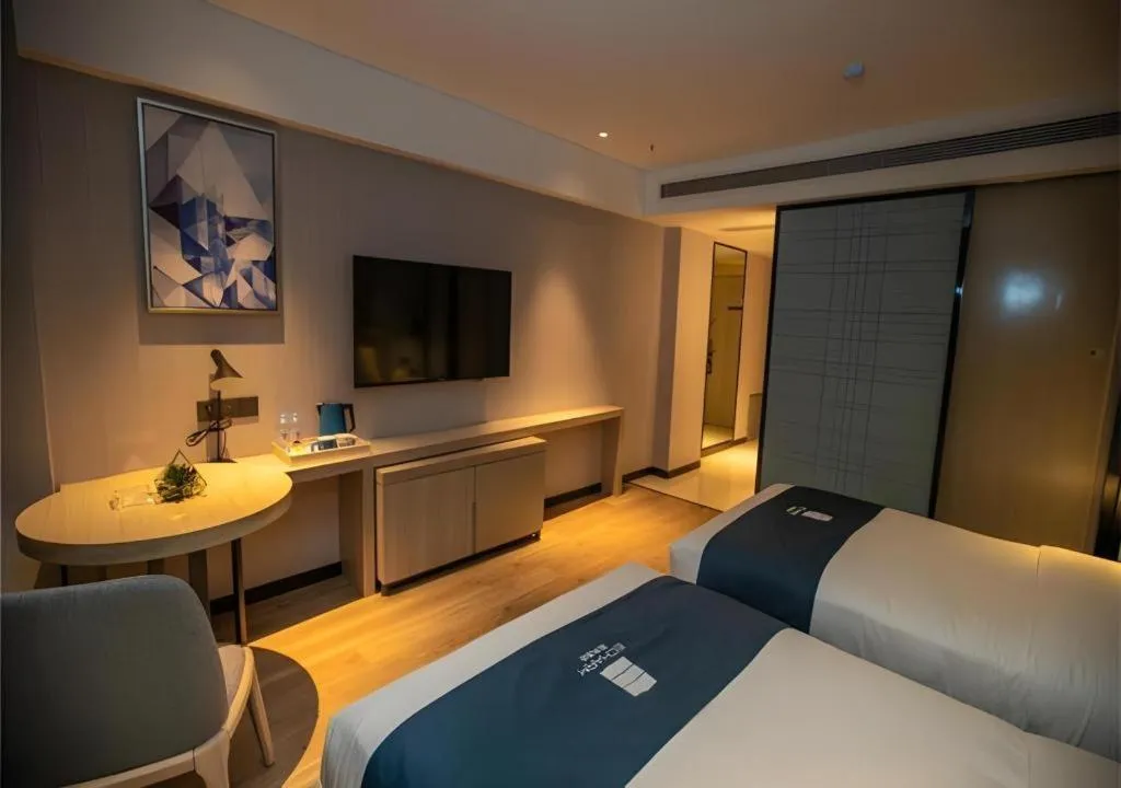 Bed in Echarm Hotel Zibo Gaoqing Zhongcheng Inernational