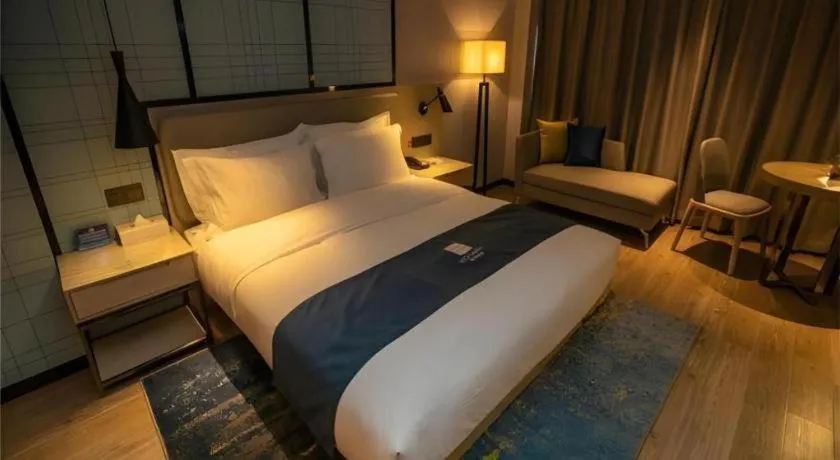 Bed in Echarm Hotel Zibo Gaoqing Zhongcheng Inernational