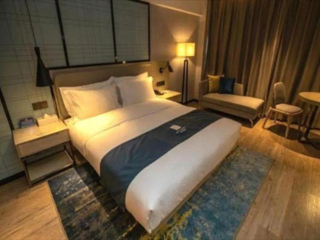 Bed in Echarm Hotel Zibo Gaoqing Zhongcheng Inernational