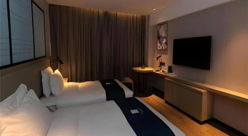 Bed in Echarm Hotel Zibo Gaoqing Zhongcheng Inernational