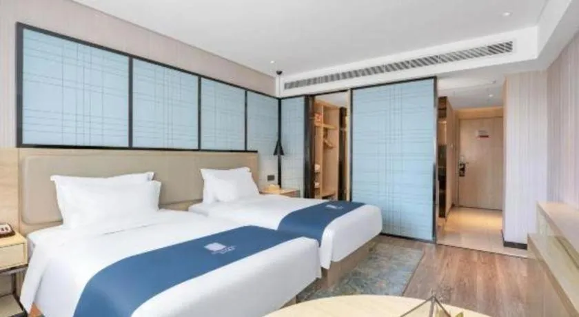 Bed in Echarm Hotel Zibo Gaoqing Zhongcheng Inernational
