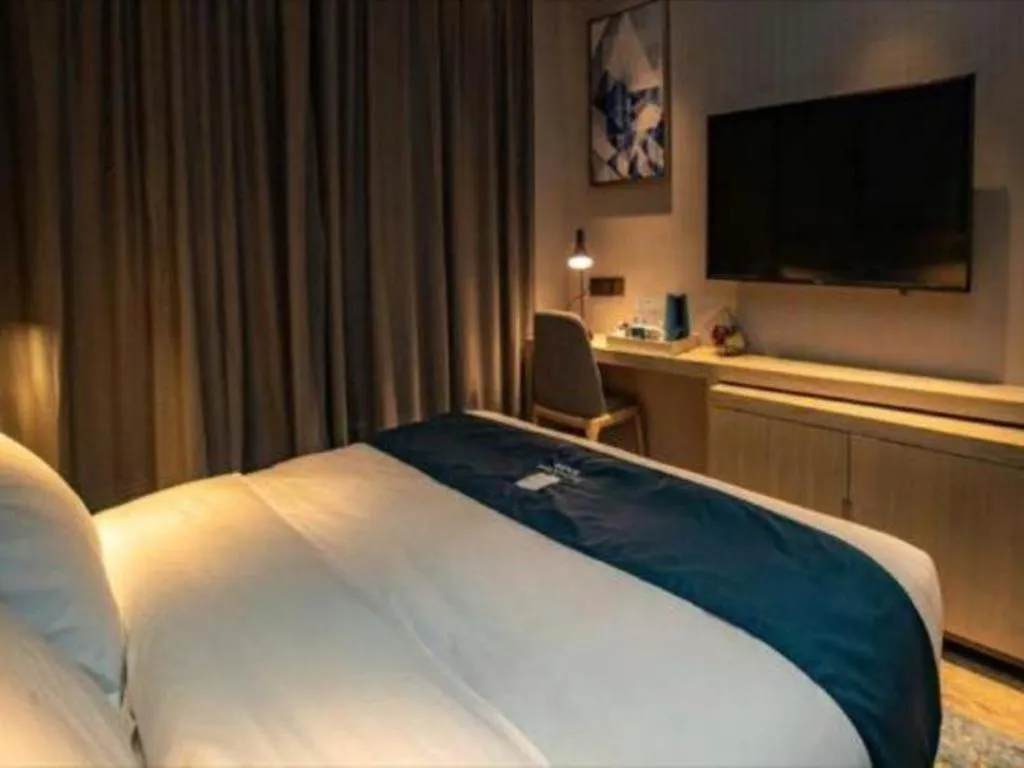 Bed in Echarm Hotel Zibo Gaoqing Zhongcheng Inernational