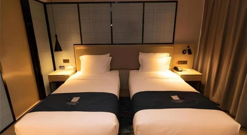 Bed in Echarm Hotel Zibo Gaoqing Zhongcheng Inernational