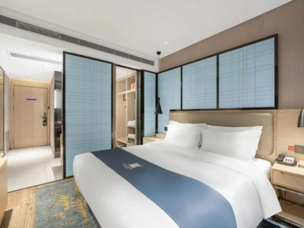 Bed in Echarm Hotel Zibo Gaoqing Zhongcheng Inernational