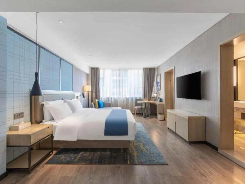 Bed in Echarm Hotel Zibo Gaoqing Zhongcheng Inernational