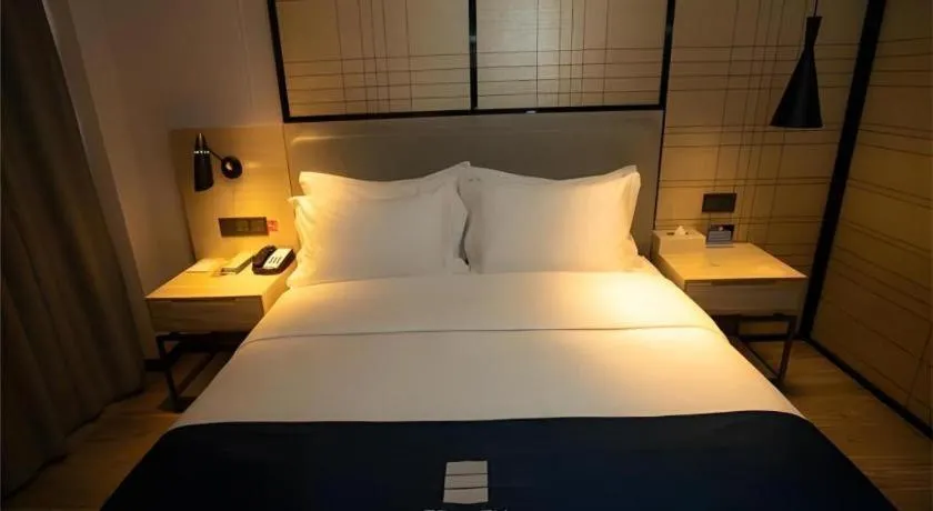 Bed in Echarm Hotel Zibo Gaoqing Zhongcheng Inernational