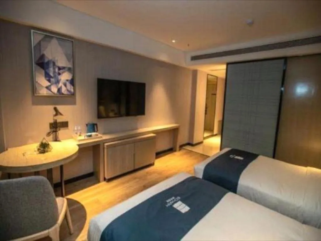 Bed in Echarm Hotel Zibo Gaoqing Zhongcheng Inernational