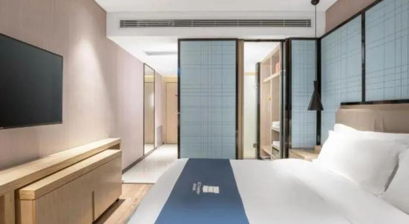 Bed in Echarm Hotel Zibo Gaoqing Zhongcheng Inernational