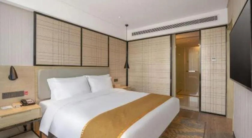 Bed in Echarm Hotel Zibo Gaoqing Zhongcheng Inernational