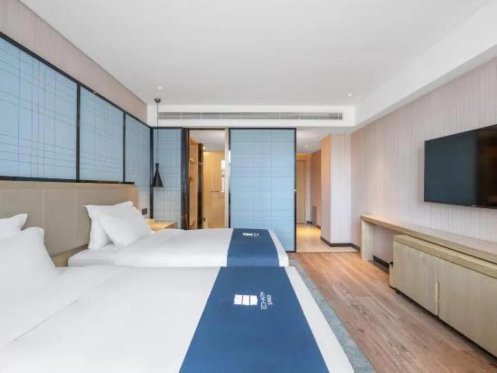 Bed in Echarm Hotel Zibo Gaoqing Zhongcheng Inernational