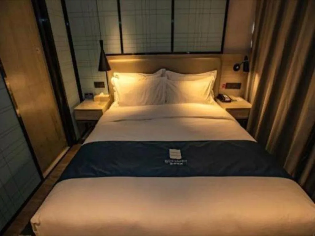 Bed in Echarm Hotel Zibo Gaoqing Zhongcheng Inernational