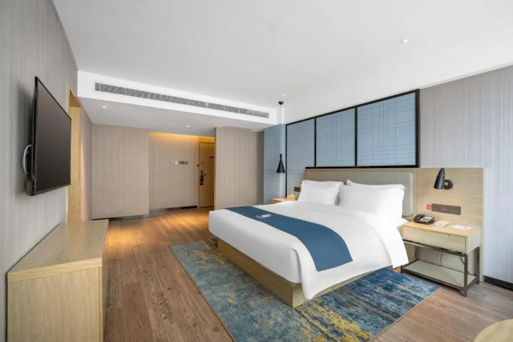 Bed in Echarm Hotel Zibo Gaoqing Zhongcheng Inernational