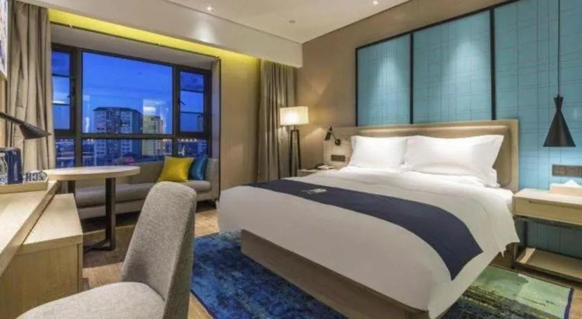 Bed in Echarm Hotel Kunming Railway Station Huancheng South Road Metro Station