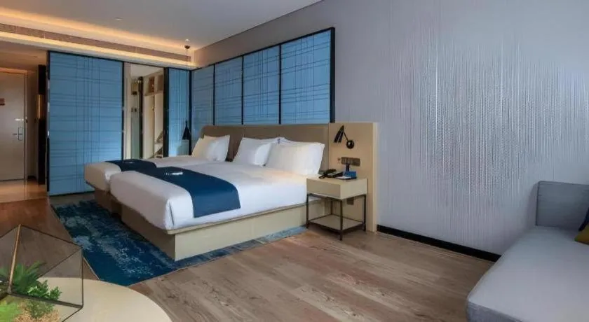 Bed in Echarm Hotel Kunming Railway Station Huancheng South Road Metro Station